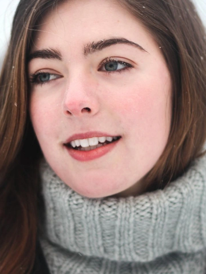 Portrait after browser compression to 25KB — smaller file, face still readable